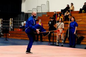 Joseph Vigneri performs Plum Blossom Spear from the Lohan or Buddha Palm Style of Kung Fu. In this trick move Vigneri is tossing the spear under one leg to catch it with the other hand in a tricky thrust.