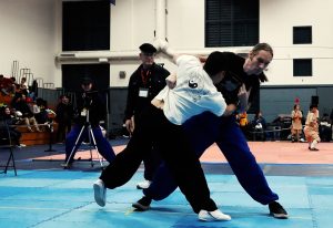 Henry Geddes off Balances his opponent and scores in the Light weight Push Hands Division.