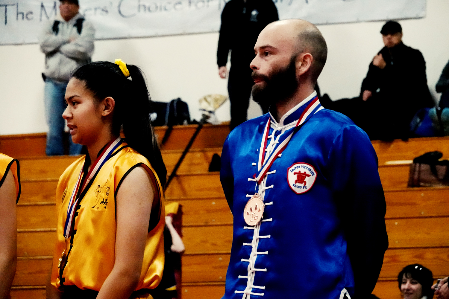 Judge Robert Alexander raises Henry Geddes hand to signal his victory in his match in Tai Chi Push Hands division.